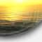 Designart - Brilliant Yellow Sunrise over Waters' Beach Photo Metal Circle Wall Art